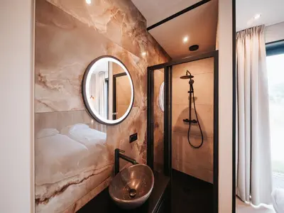 a bathroom with a sink and a mirror at Beautiful holiday home in Waarland in Waarland