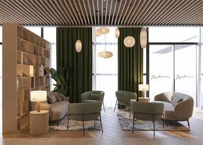 a lobby with couches and chairs and windows at Radisson Hotel Amsterdam Schiphol Airport Hoofddorp in Hoofddorp