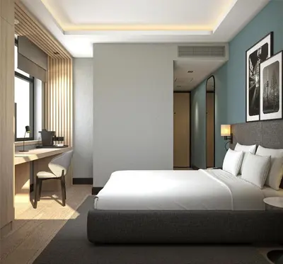 a hotel room with a bed and a desk at Radisson Hotel Amsterdam Schiphol Airport Hoofddorp in Hoofddorp