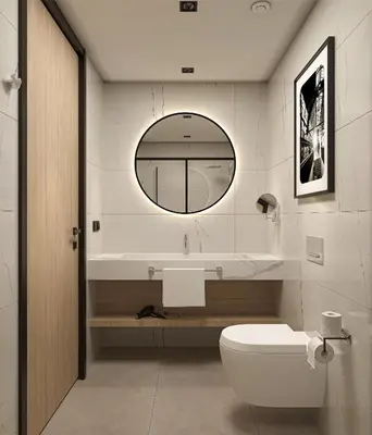 a bathroom with a toilet and a sink and a mirror at Radisson Hotel Amsterdam Schiphol Airport Hoofddorp in Hoofddorp