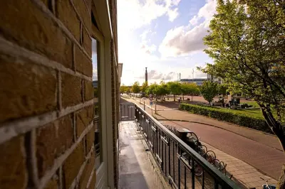 a window of a building with a view of a street at Olympic's Little Palace in Amsterdam