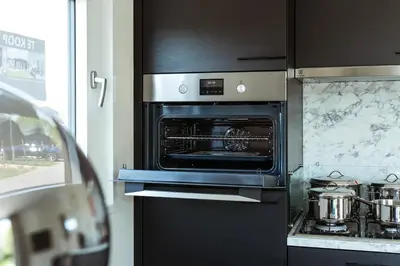an oven in a kitchen with pots and pans at Kaag Villas in Warmond