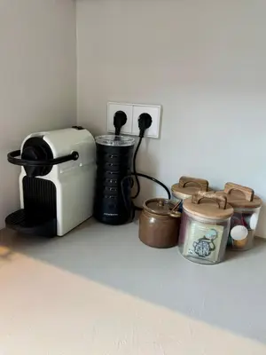 a kitchen counter with a toaster and other kitchen items at Moyeni in Zandvoort