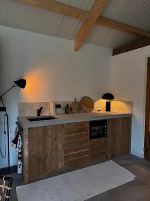 a kitchen with a sink and a counter top at B&B Molenweg in Laren