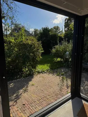 a view from a window of a brick driveway at B&B Molenweg in Laren