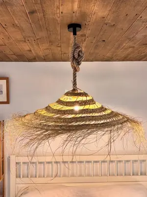 a chandelier hanging from a ceiling at B&B Molenweg in Laren
