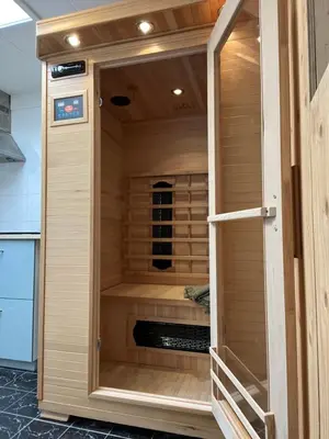 a sauna in a kitchen with wooden walls at Zeemeeuw aan Zee in Egmond aan Zee