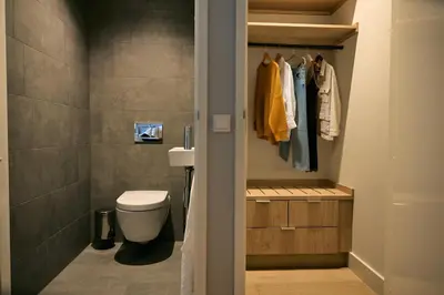 a bathroom with a toilet and a sink at Wilde Aparthotels Amsterdam Noord in Amsterdam