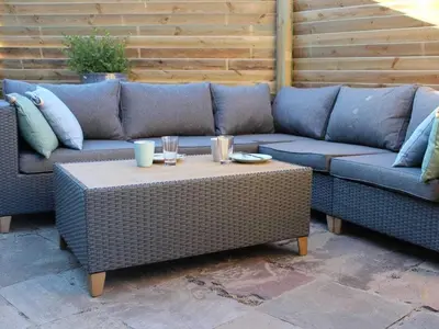 two couches and a coffee table on a patio at One-bedroom apartment in Heemskerk