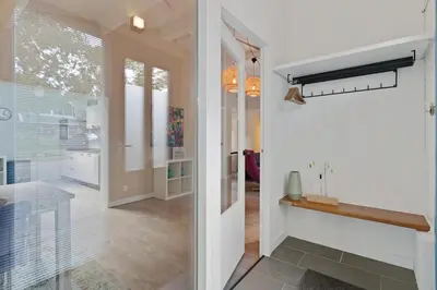 a hallway of a home with a glass door at Boerderijwoning 't Boetje in Heiloo
