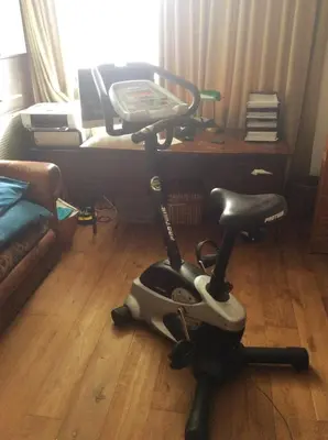 a exercise bike on the floor in a living room at Welcoming Apartment with Character & Great Views in Amsterdam