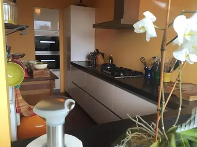 a kitchen with a stove and a counter top at Welcoming Apartment with Character & Great Views in Amsterdam