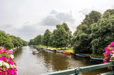 a view of a river with boats on it at Welcoming Apartment with Character & Great Views in Amsterdam