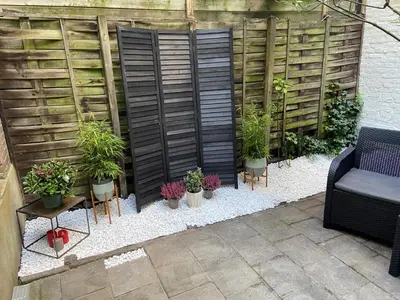 a group of plants in pots on a patio at Luxury Leidseplein with Private Patio in Amsterdam