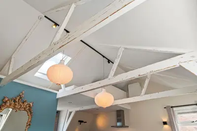 a room with two lights hanging from the ceiling at Abcoude city center in Abcoude
