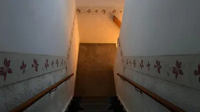 a staircase in a building with a stair case at Zaanvilla in Wormerveer