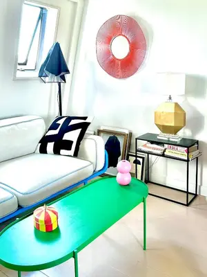 a living room with a couch and a green coffee table at Top floor apartment at Westerpark and Jordaan in Amsterdam