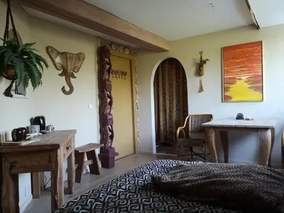 a living room with a table and a table and a table sidx sidx at South African lodge in Westbeemster