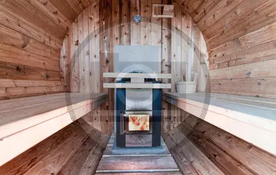 a sauna with a fireplace in a wooden wall at Stunning Home In Vinkeveen With Sauna in Vinkeveen