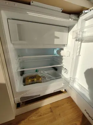 an open refrigerator with a yellow object in it at Floating holiday home close to AMS