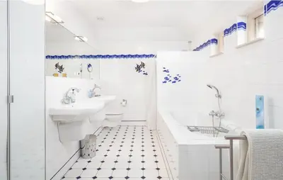 a bathroom with a sink and a toilet and a tub at Light-flooded villa in Bergen aan Zee