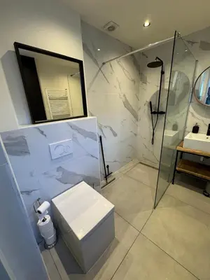 a bathroom with a shower and a toilet and a sink at Cozy apartment in Utrecht in Utrecht