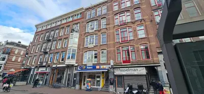 a group of buildings on a city street at Spacious Room with private king bathroom in Amsterdam