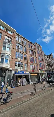 a group of bikes parked in front of a building at Spacious Room with private king bathroom in Amsterdam