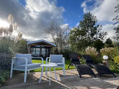 a group of chairs and a table on a patio at Rijn Residentie in Alphen aan den Rijn