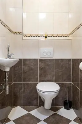 a bathroom with a toilet and a sink at Seebrise Apartment with parking in Zandvoort