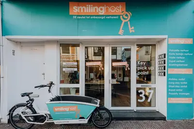 a bike parked in front of a building at Seebrise Apartment with parking in Zandvoort