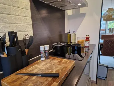 a kitchen with a counter with pots and pans on a stove at Kintsugi in Alphen aan den Rijn