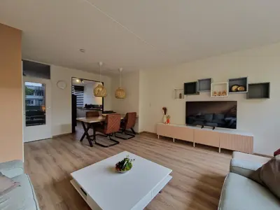 a living room with a couch and a table at Kintsugi in Alphen aan den Rijn