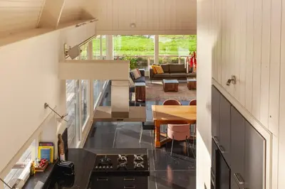 a view of the kitchen and living room of a house at 10P 4B Luxe Villa with Pool and Sauna in Spijkerboor in Spijkerboor