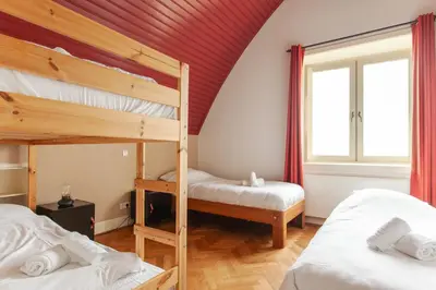 two bunk beds in a room with a red ceiling at 10P 4B Luxe Villa with Pool and Sauna in Spijkerboor in Spijkerboor