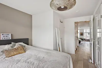 a bedroom with a bed and a ceiling at Charming Apartment in City Centre in Amsterdam