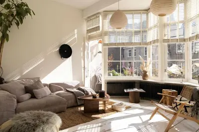 a living room with a couch and a table at The Bright Loft - City Centre Amsterdam in Amsterdam