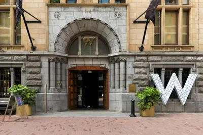 a building with a w sign in front of it at The Bright Loft - City Centre Amsterdam in Amsterdam