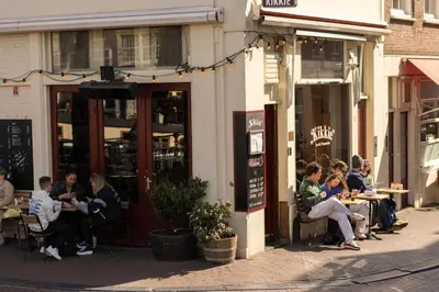 a group of people sitting outside of a restaurant at The Bright Loft - City Centre Amsterdam in Amsterdam