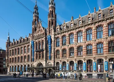 a large building with a clock tower on top of it at The Bright Loft - City Centre Amsterdam in Amsterdam