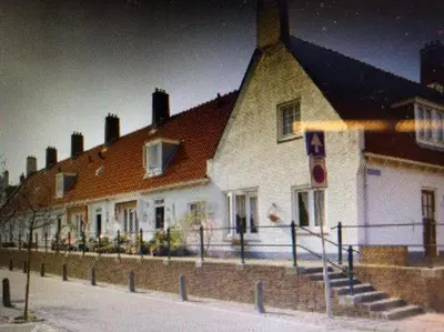 a large white house with a brown roof at Appartement Seabird in Zandvoort