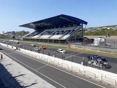 a race track with cars on a highway next to a stadium at Appartement Seabird in Zandvoort