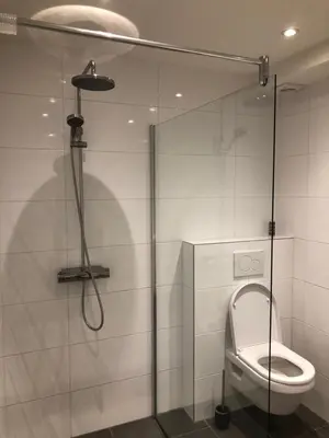 a shower stall with a toilet in a bathroom at Savina oase nabij centrum, zee en station in Zandvoort