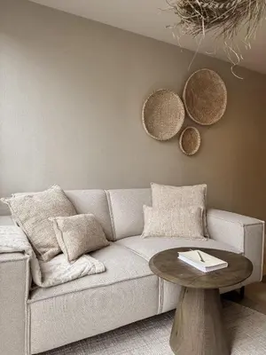 a living room with a couch and a table at C Studio Katwijk in Katwijk aan Zee