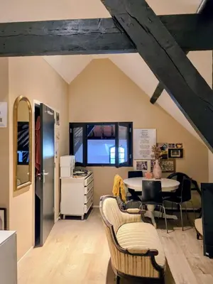 a living room with a table and chairs at Op Vakantie bij Nicole in Putten