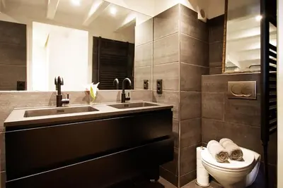 a bathroom with a sink and a toilet in it at Canal view luxury apartment in the Jordaan in Amsterdam