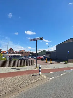 a street sign on the side of a road at Have e nice stay! - Juul 18, free parking in Noordwijk