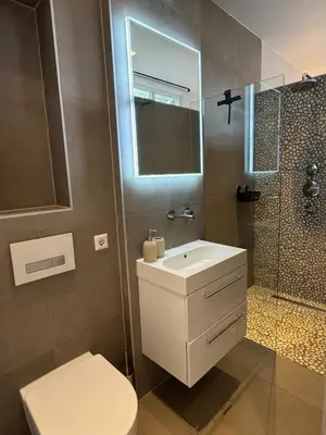 a bathroom with a toilet and a sink and a shower at The Park Loft in Amsterdam