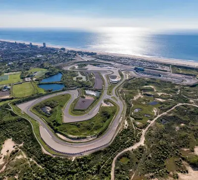 an aerial view of a road near the ocean at Palm Beach apartments in Zandvoort