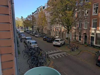 a street with bikes parked on the side of a building at Apartment in Museumplein in Amsterdam